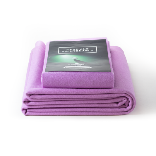 Hainsworth-SMART folded hot pink pool table cloth with a care and maintenance guide on a white background