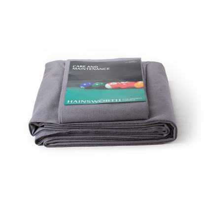 Folded silver fabric with Hainsworth label on a white background