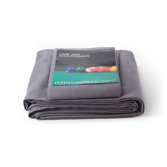 Folded silver fabric with Hainsworth label on a white background